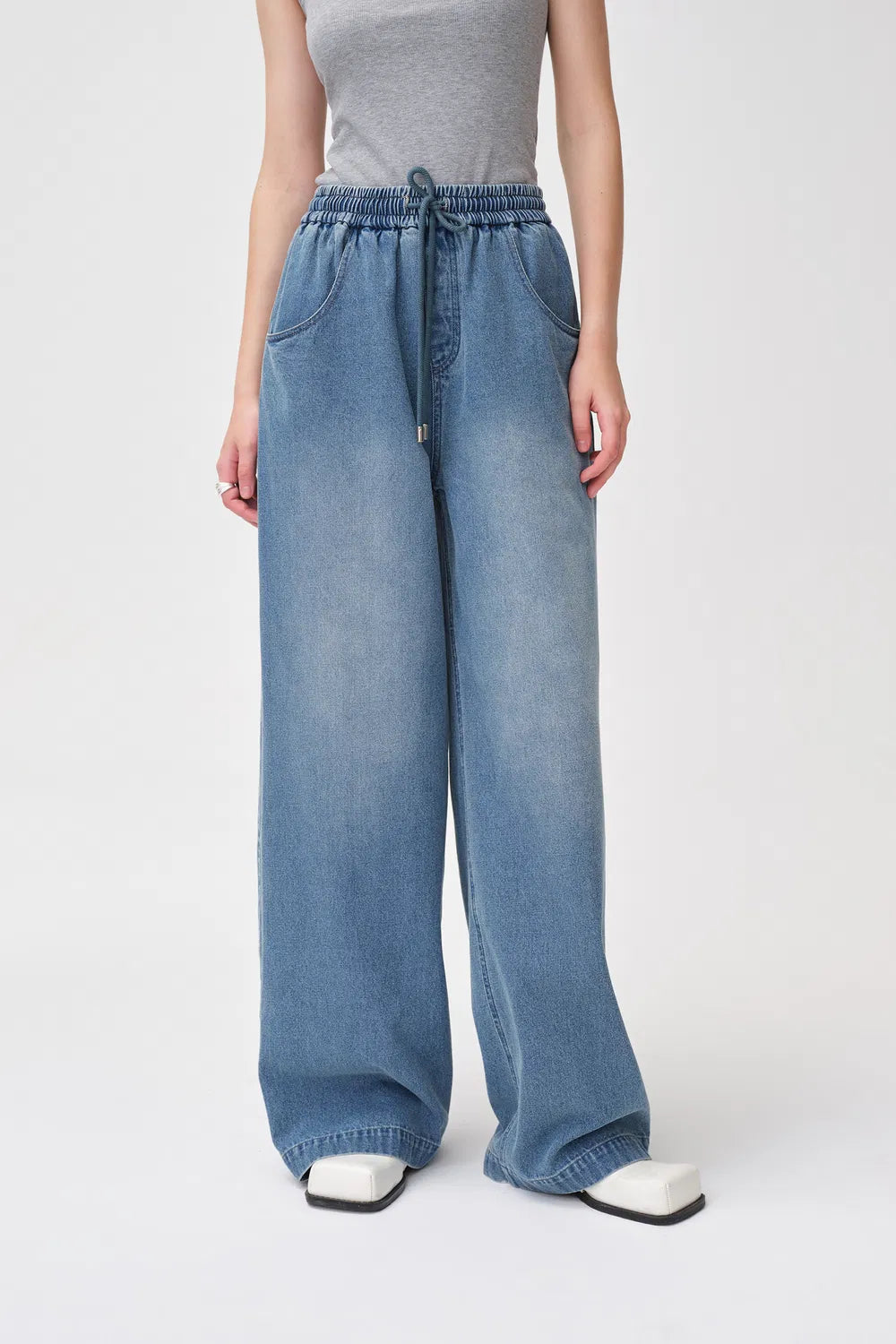 Elastra high-waisted drawstring jeans in soft stretch denim
