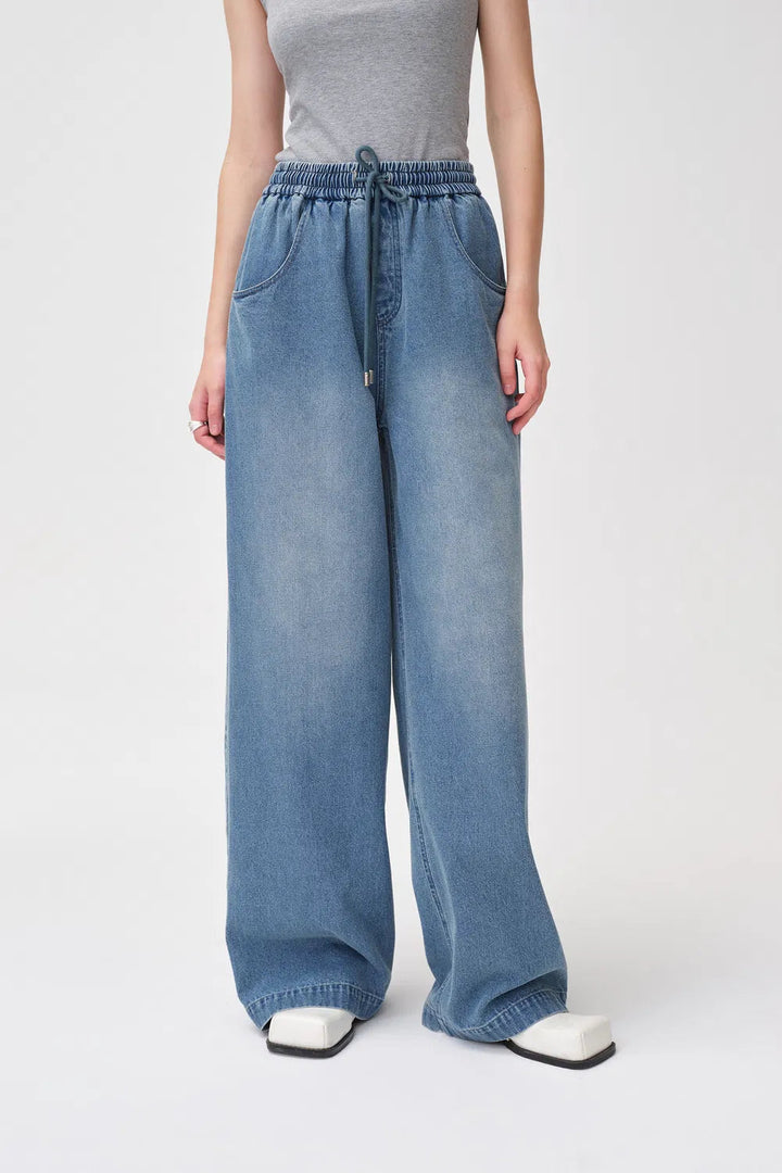 Elastra high-waisted drawstring jeans in soft stretch denim
