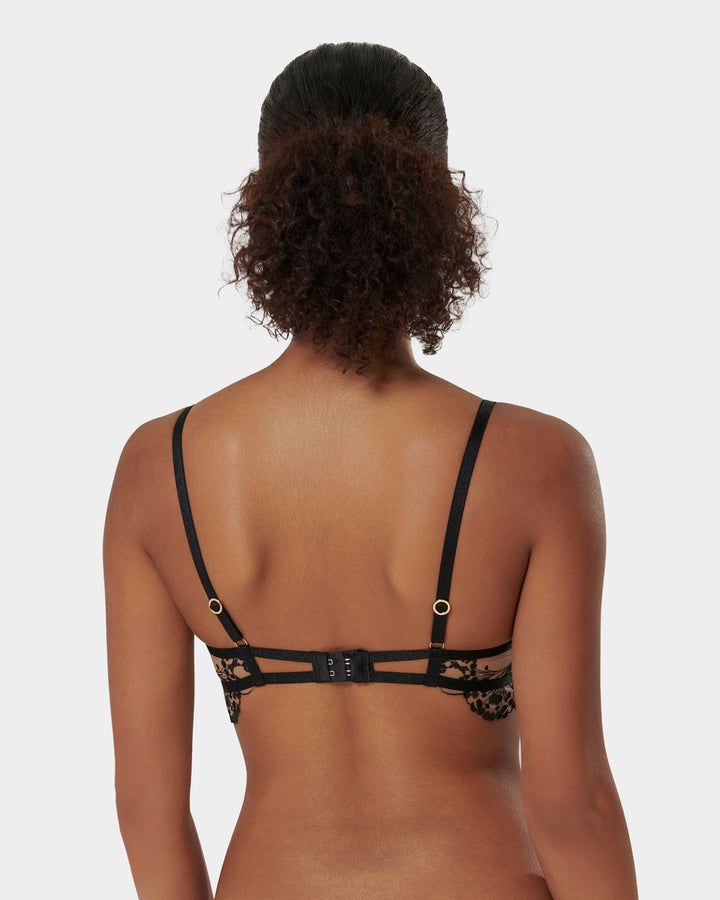 Marisa Bra laid flat showing black embroidery and straps

