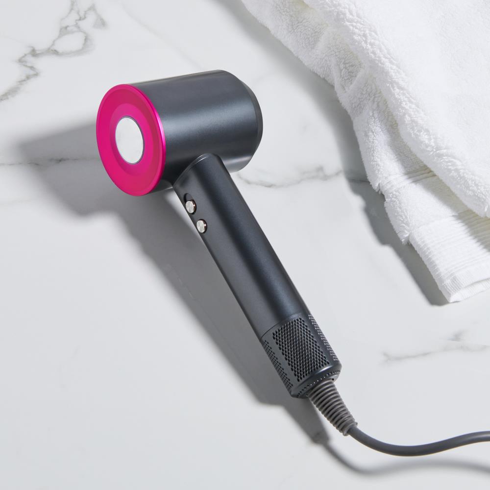 Sleek black ionic hair dryer placed on bathroom counter
